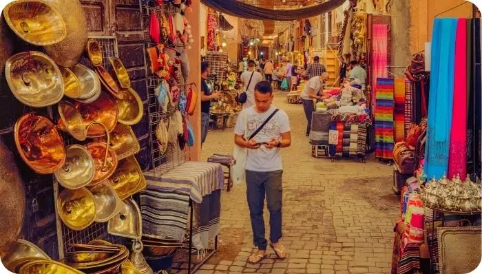 Tourist buying souvenirs at the souk of  Fez
