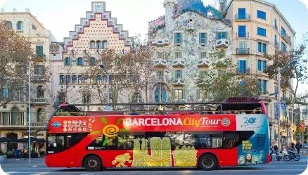 Barcelona City Tour tourist bus in front of Casa Batllo