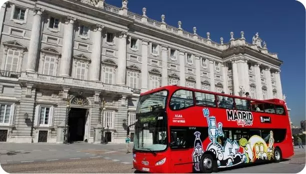 Madrid's hop on hop off bus in front of Palacio Real