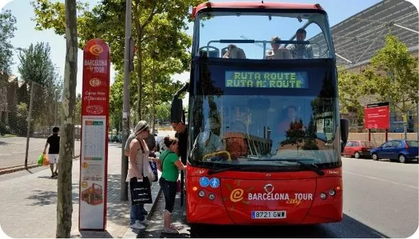 Tourist boarding the Barcelona's tourist bus